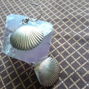 sterling silver shell shaped pierced earrings.